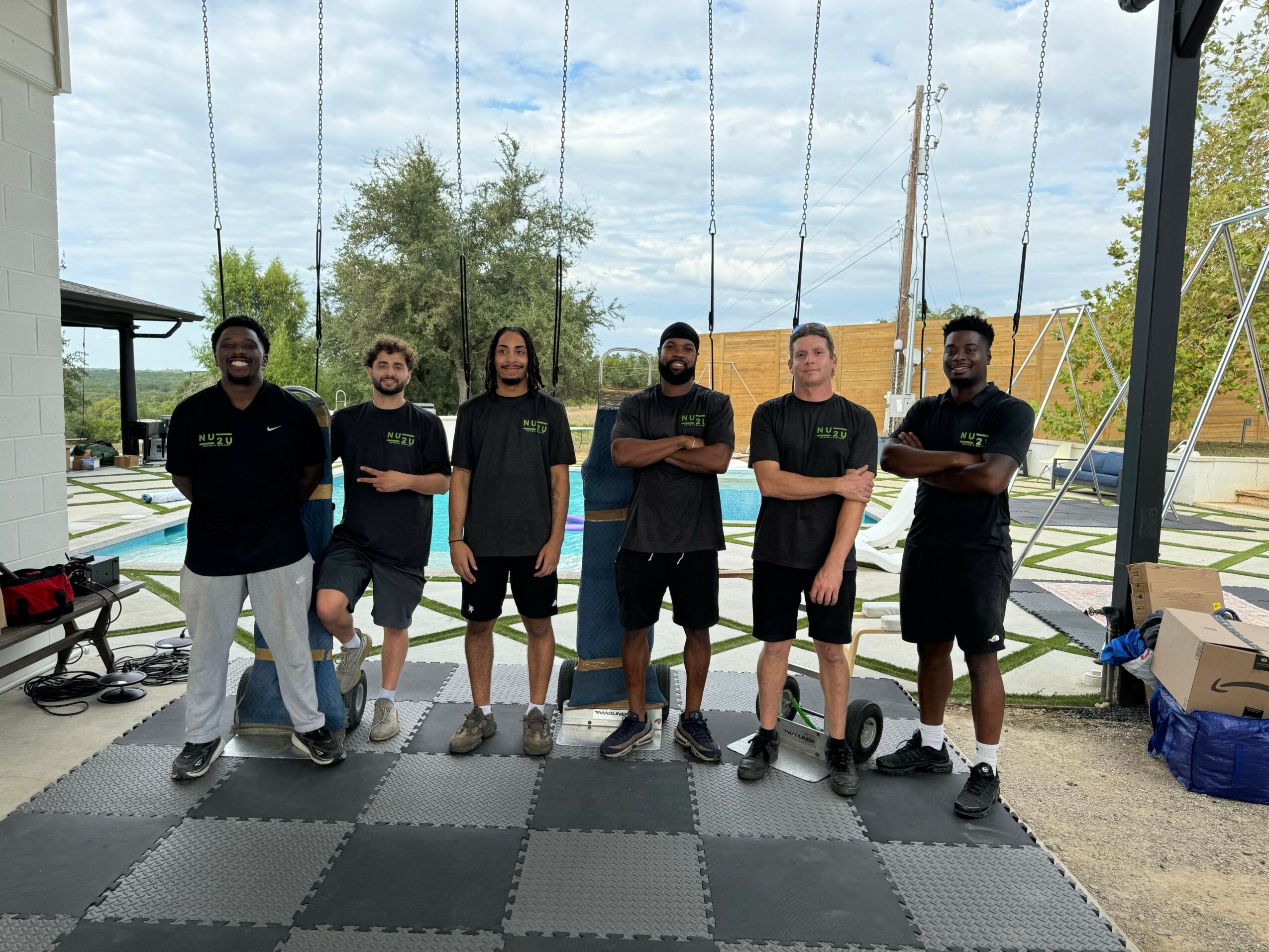The Nu2U Moving crew in matching branded shirts